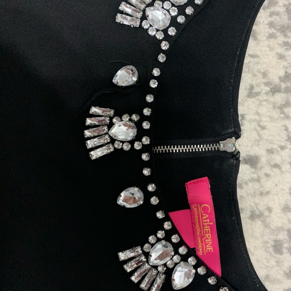 Beautiful sleeveless blouse.